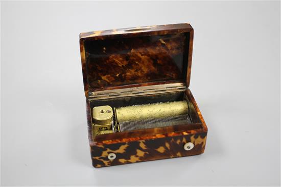 A late 19th century Swiss gold mounted tortoiseshell musical box, inset with a miniature of a young lady, width 8cm depth 5.5cm height